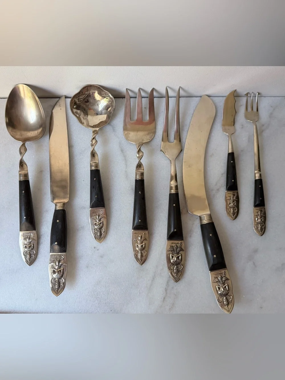 set consists of vintage Thai brass or bronze utensils with dark wooden handles.